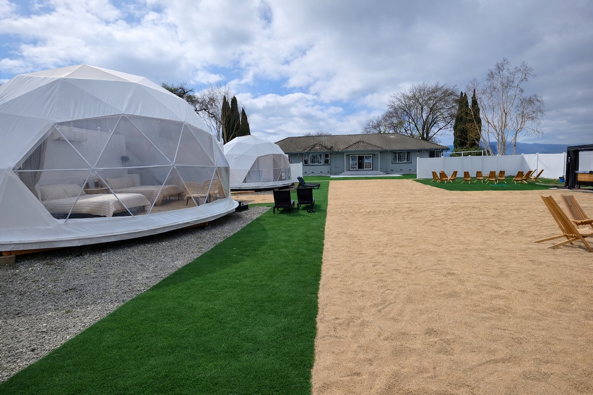 Geodesic domes beside the main house
